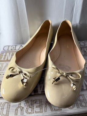 kate spade Cream Patent Ballet Flats with Bow and Charm